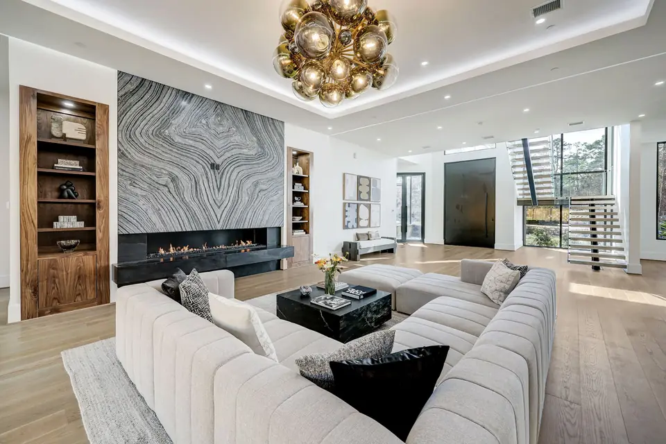 Living room with marble fireplace wall